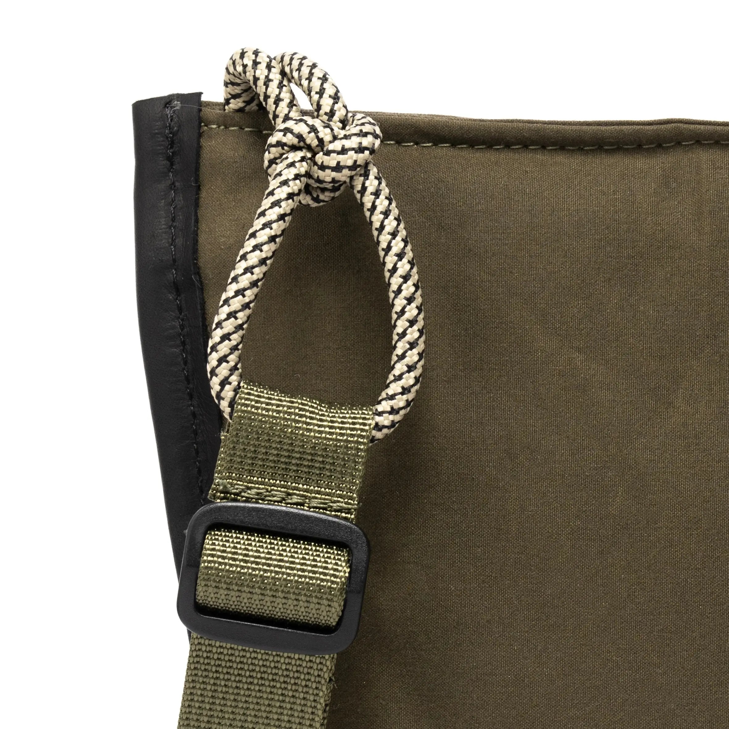Olive shoulder/cross body bag showing strap detail on white background
