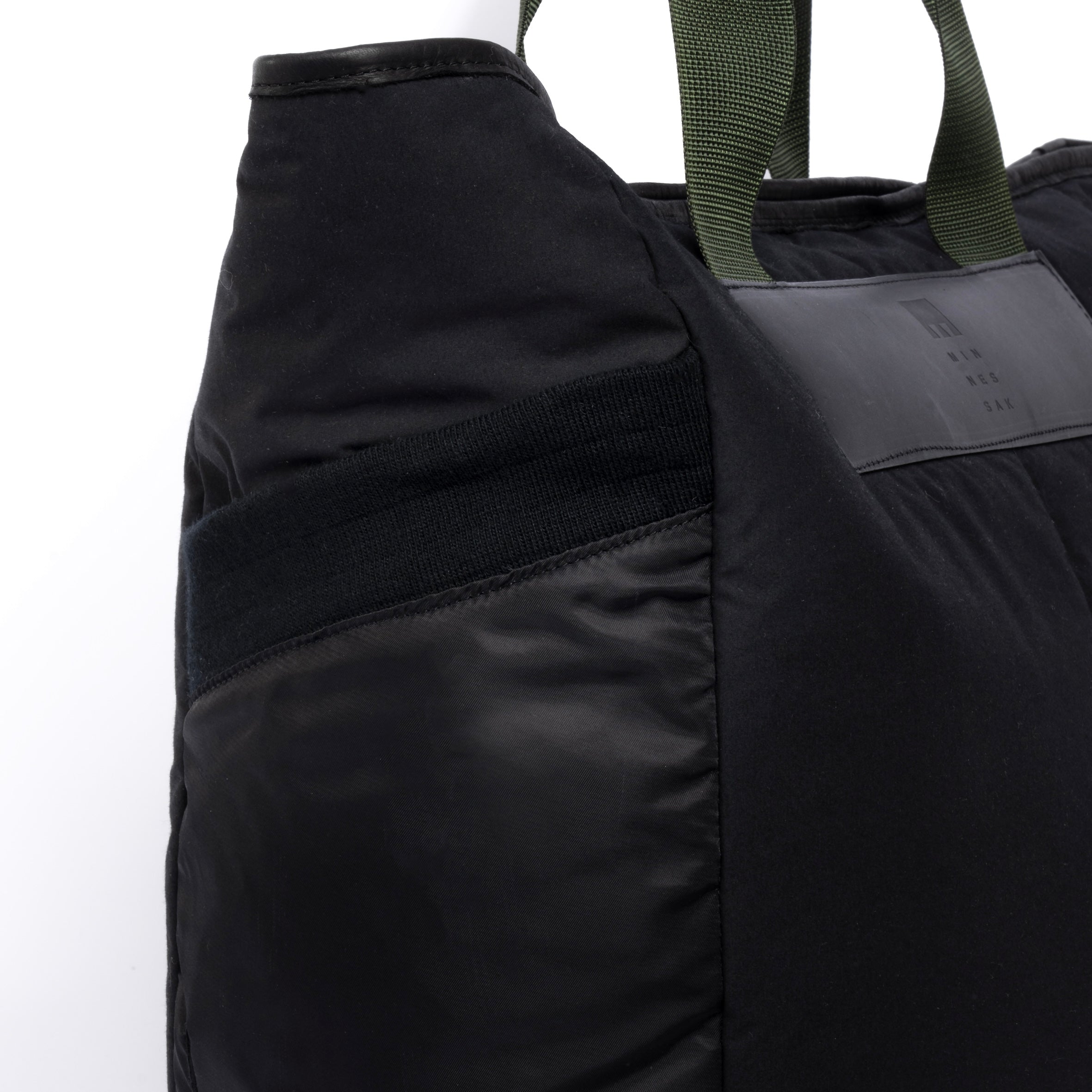 Large black tote bag pocket detail on white background