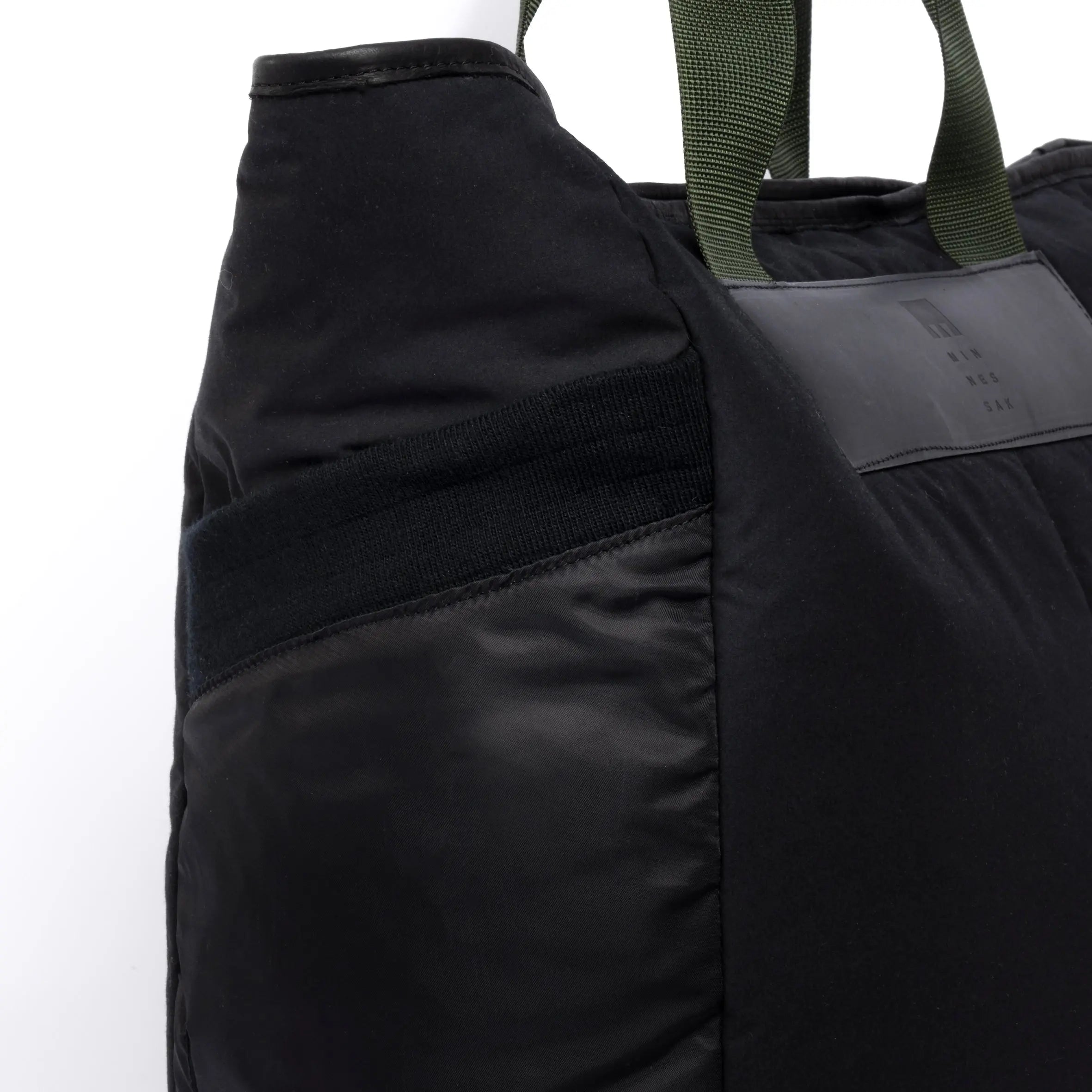 Large black tote bag pocket detail on white background