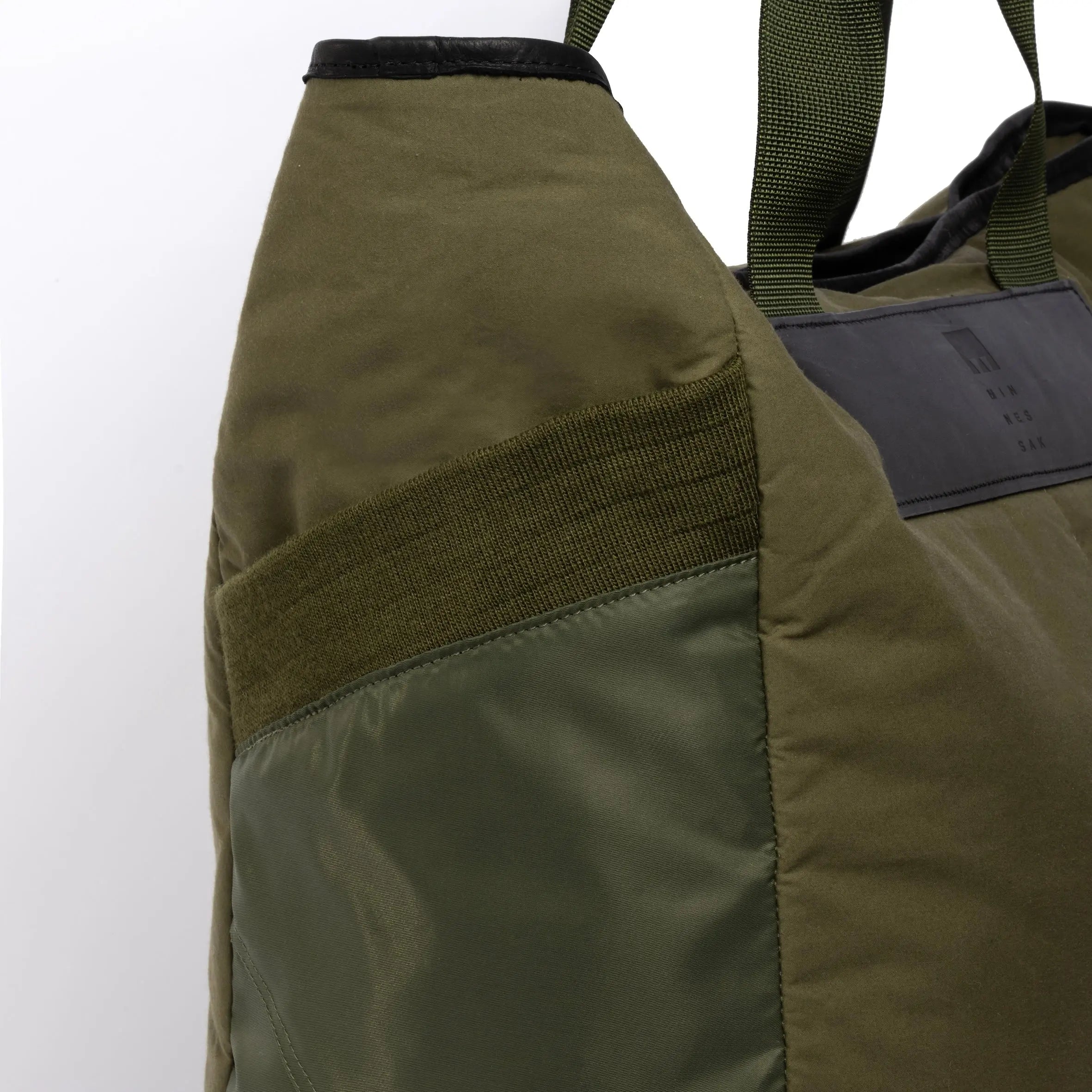 Large olive tote bag pocket detail on white background