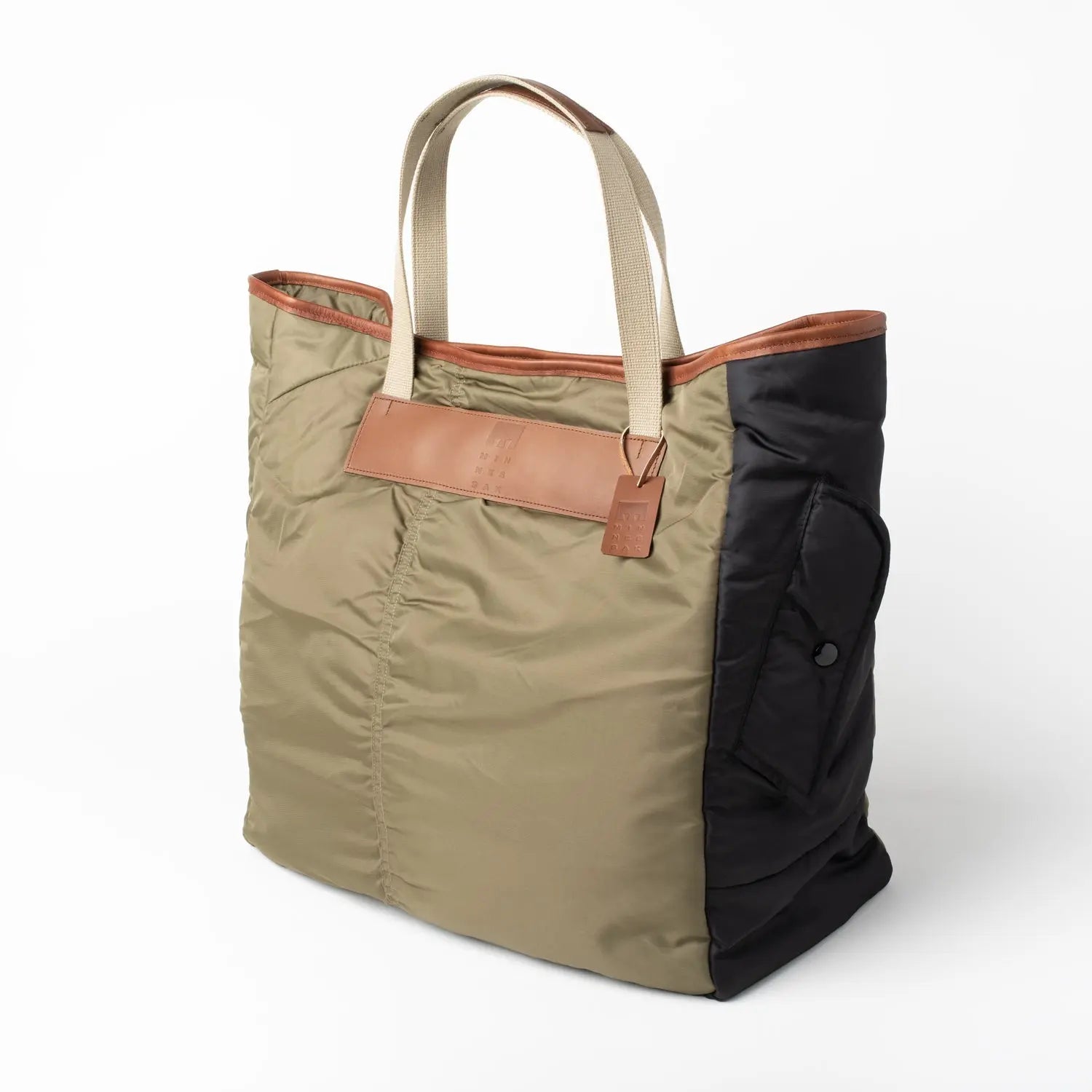 Multicolored tote bag with beige handle on a white background