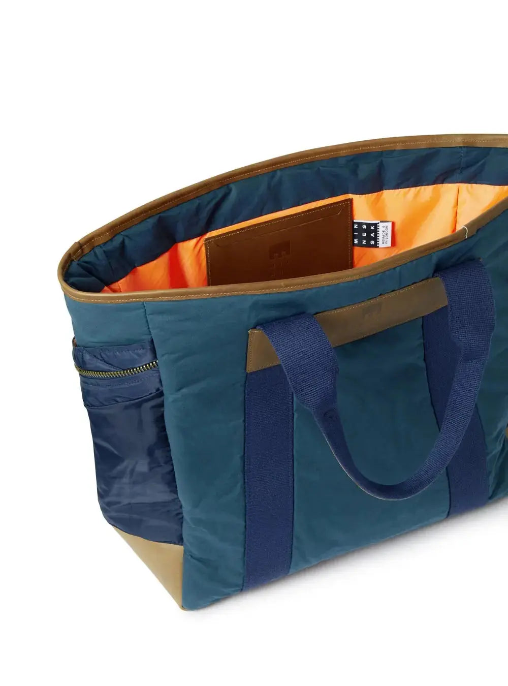 Navy Blue and brown tote bag with orange interior on a white background