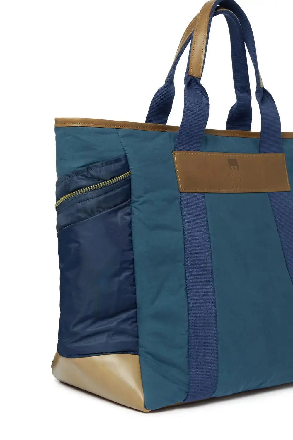 Navy Blue and brown tote bag with a visible brand label on a white background
