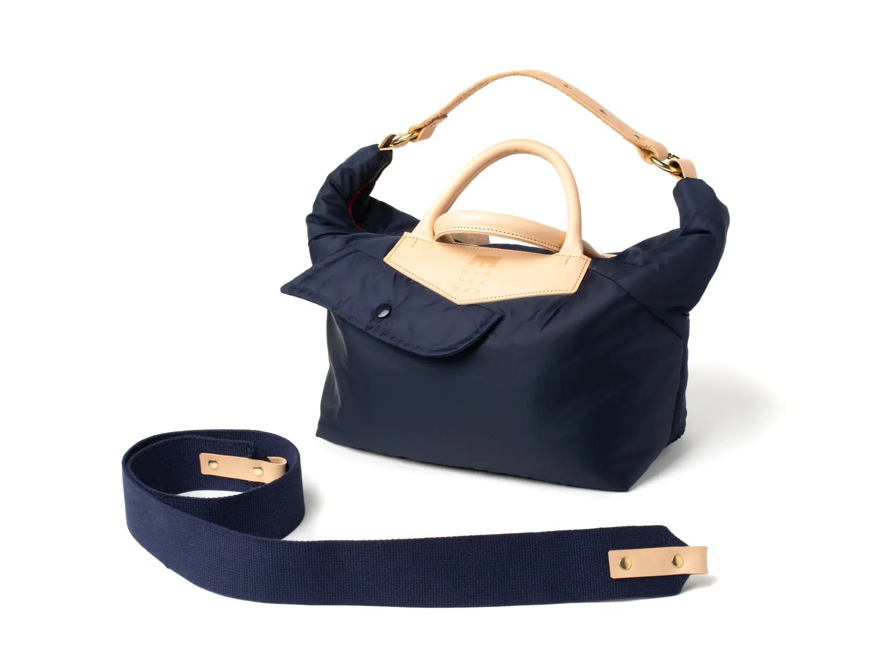 Navy blue handbag with beige accents on a white background