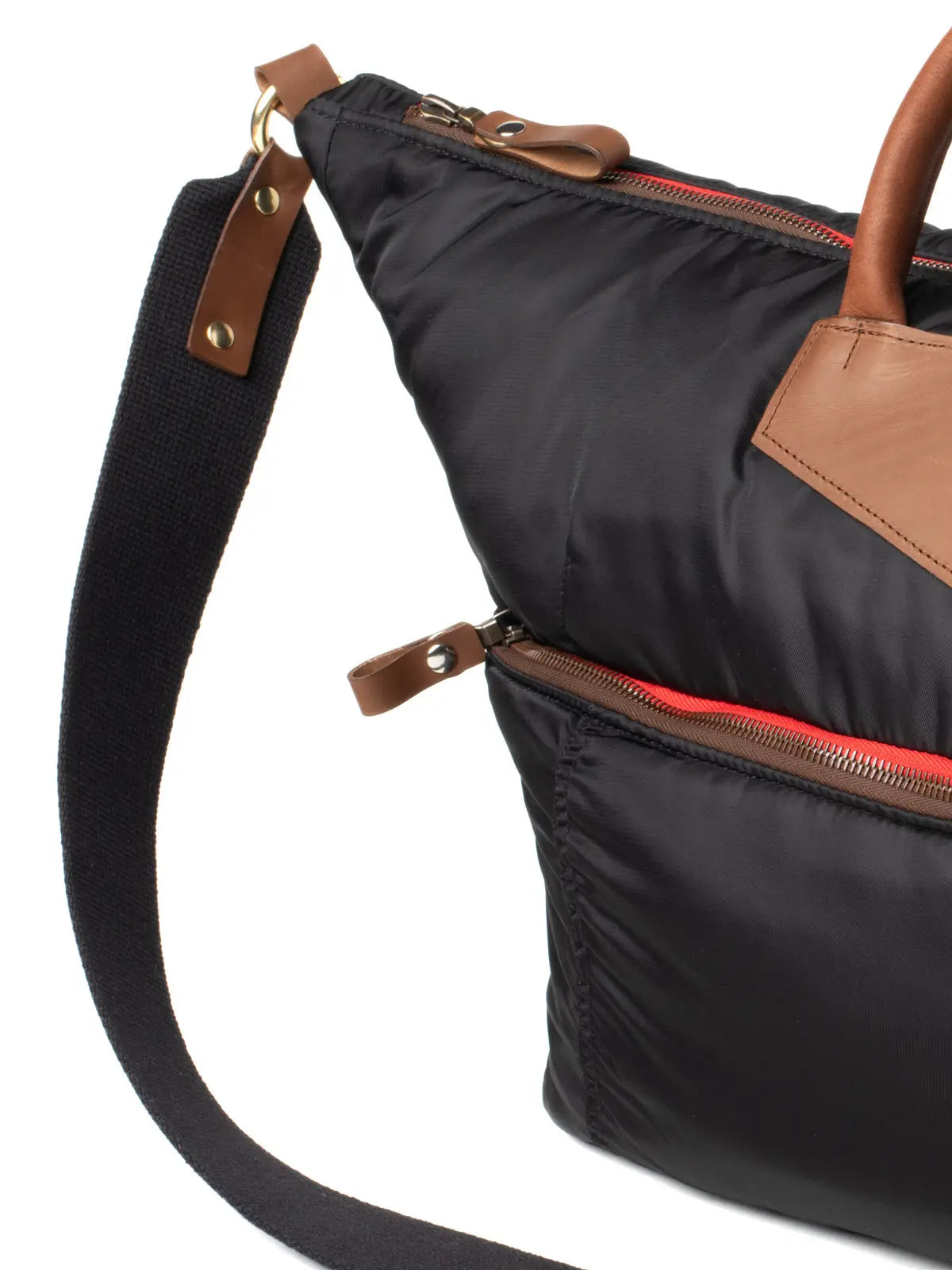 Black bag with brown leather accents on a white background