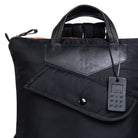 Black bag with a visible brand tag on a white background