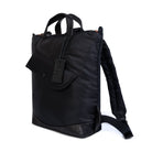 Black backpack with a tag on a white background
