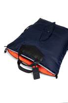 Navy blue and orange interior with a black handle on a white background