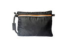 Black travel pouch with an orange zipper on a white background