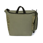 Olive backpack with black accents on a white background