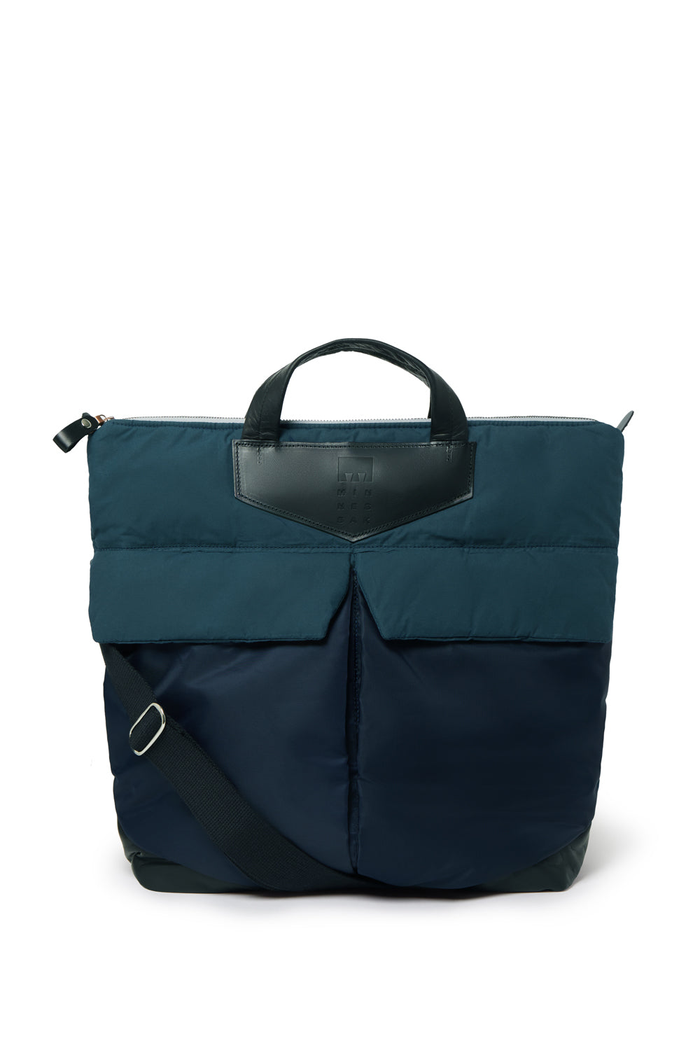 Navy backpack with a leather patch on a white background
