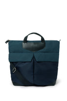 Navy backpack with a leather patch on a white background