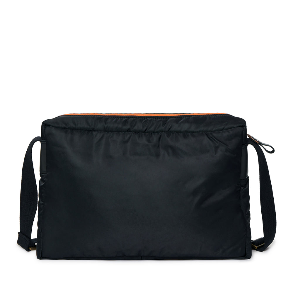 Black shoulder bag with orange interior lining on a white background
