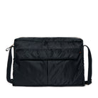 Black bag with a shoulder strap on a white background
