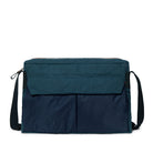 Navy and teal bag with a shoulder strap on a white background