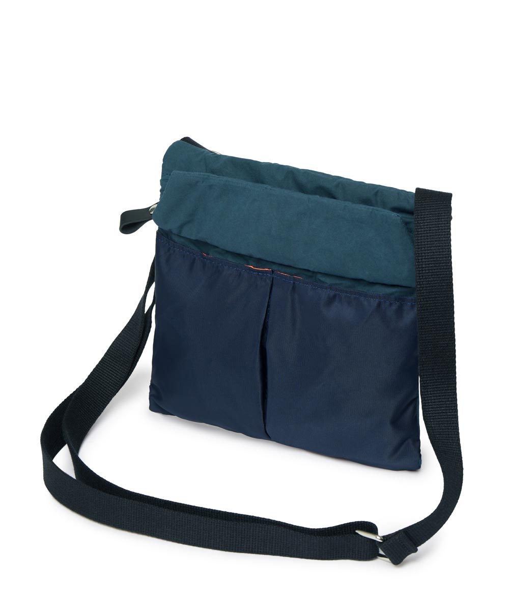 Navy and teal crossbody bag on a white background