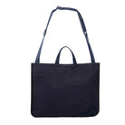 Navy blue medium size tote bag with shoulder strap and Minnessak logo on white background
