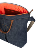 Blue denim bag with brown handles and orange interior on a white background