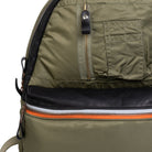 Close-up of a Olive backpack with zippers and a pocket.