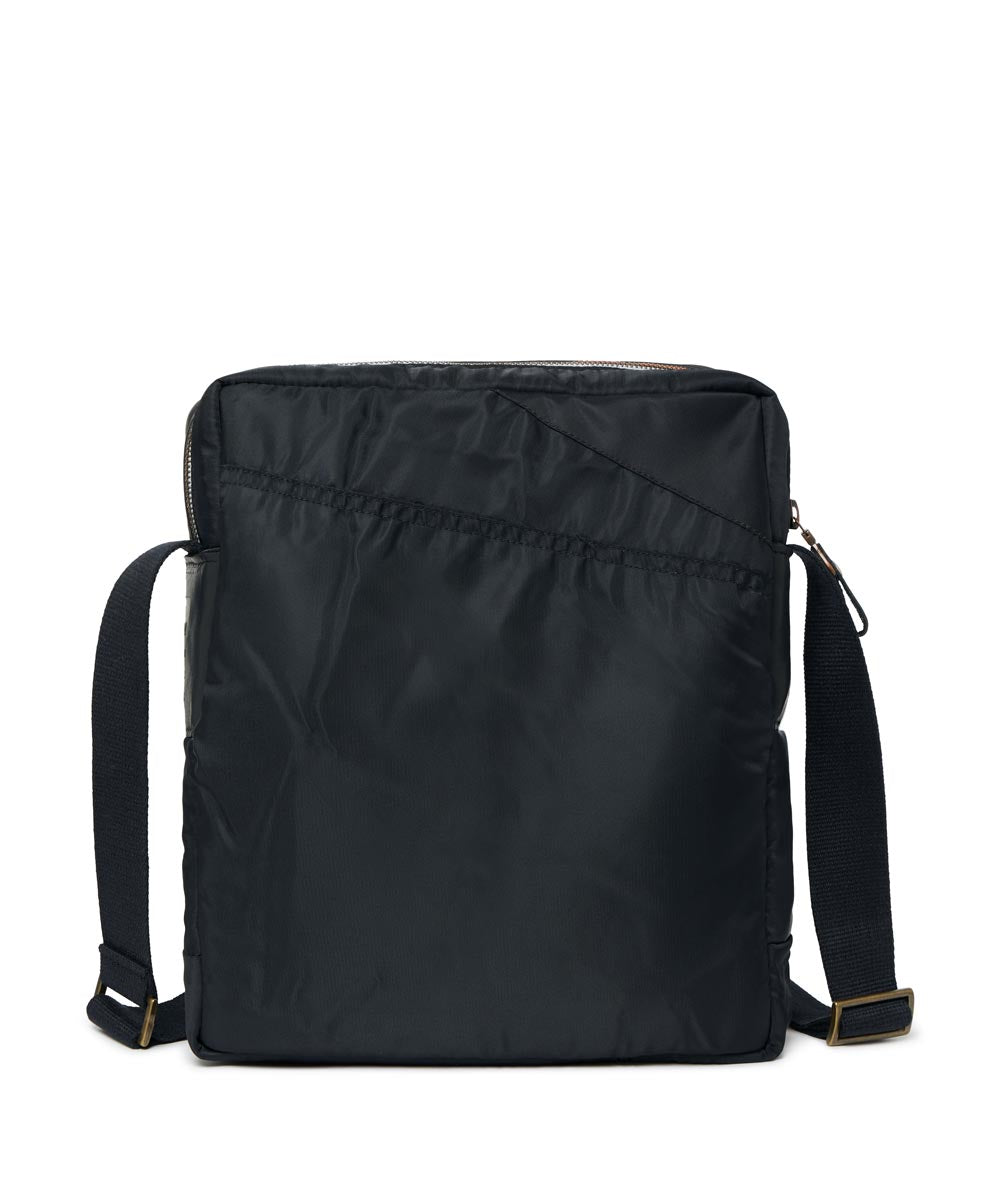 Black backpack with straps on a white background