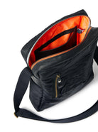 Black shoulder bag with orange interior on a white background