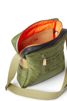 Olive shoulder bag with orange interior on a white background