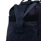 Navy Weekender/Gym bag showing strap detail on white background