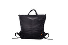 Black Back Up/26 sustainable backpack handmade from repurposed MA-1 flight jacket material with quilted shoulder straps and vintage Italian leather details.