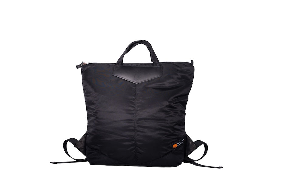Black Back Up/26 sustainable backpack handmade from repurposed MA-1 flight jacket material with quilted shoulder straps and vintage Italian leather details.