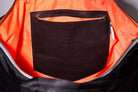 Black Back Up/26 sustainable backpack handmade from repurposed MA-1 flight jacket material with internal, embossed, vintage Italian leather pocket stitched to orange, recycled polyester lining.