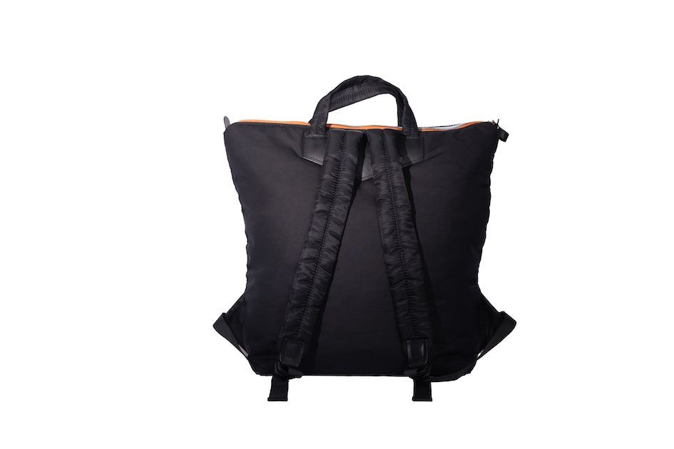 Black Back Up/26 sustainable backpack handmade from repurposed MA-1 flight jacket material with adjustable, quilted shoulder straps and vintage Italian leather details.