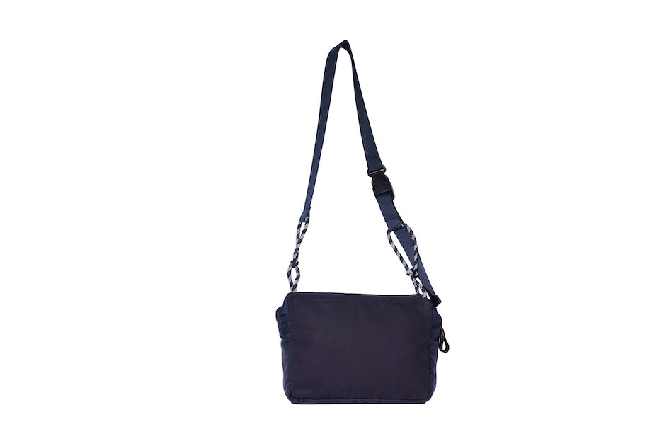 Navy Just Flight [Small], small, sustainable utility crossbody bag, handmade in London from repurposed MA-1 flight jackets and deadstock waxed cotton material, with two zip compartments and adjustable strap.