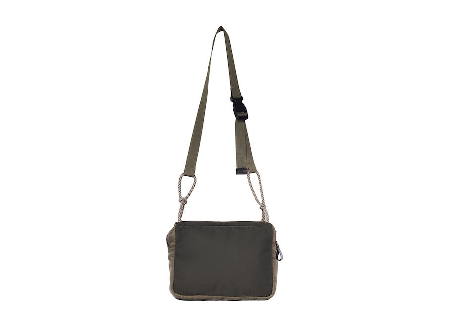 Olive Just Flight [Small], small, sustainable utility crossbody bag, handmade in London from repurposed MA-1 flight jackets and deadstock waxed cotton material, with two zip compartments and adjustable strap.