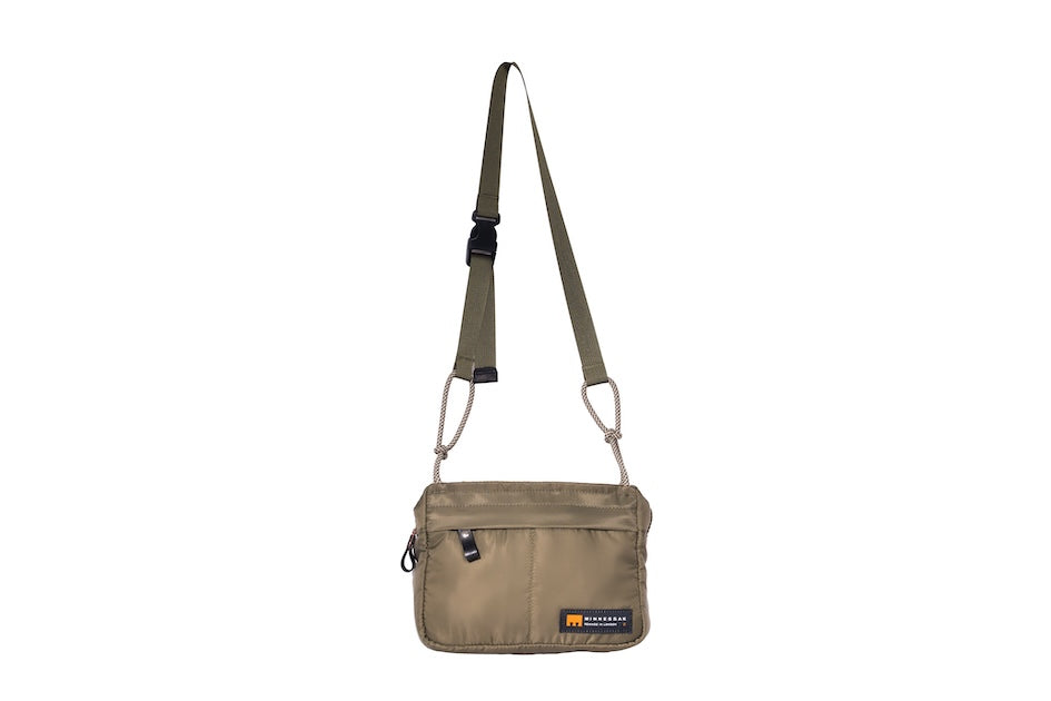 Olive Just Flight [Small], small, sustainable utility crossbody bag, handmade in London from repurposed MA-1 flight jackets and deadstock waxed cotton material, with two zip compartments.