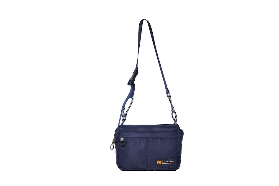 Navy Just Flight [Small], small, sustainable utility crossbody bag, handmade in London from repurposed MA-1 flight jackets and deadstock waxed cotton material, with two zip compartments.