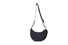 Black Boat Small sustainable crescent crossbody bag handmade from deadstock Halley Stevensons dry waxed cotton material, with adjustable shoulder strap. 