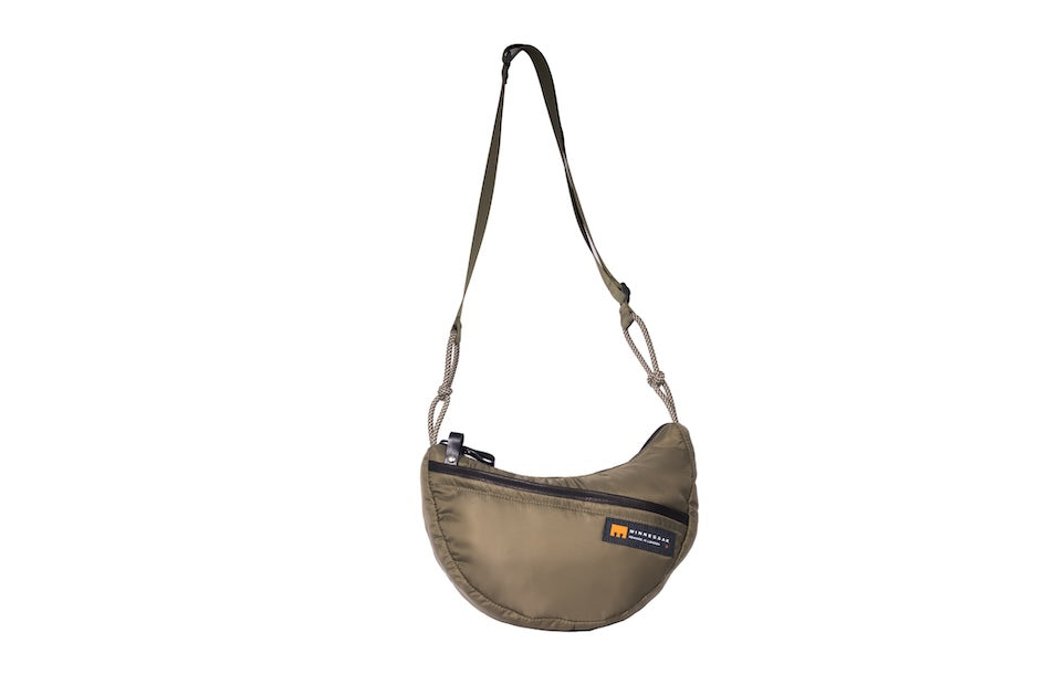 Olive Boat Small sustainable crescent crossbody bag handmade from repurposed MA-1 flight jacket material with adjustable shoulder strap and front zip pocket. Front