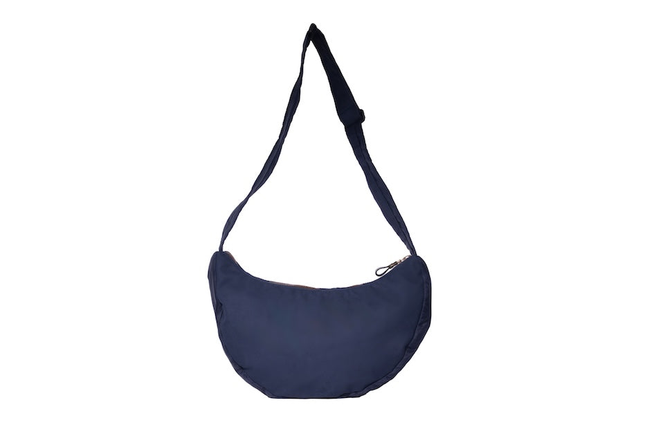 Navy Boat [Medium] crescent crossbody bag with adjustable strap, handmade from repurposed MA-1 flight jacket material and deadstock Halley Stevensons dry waxed cotton material. Back