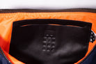 Navy Boat [Medium] crescent crossbody bag with internal MInnessak embossed vintage Italian leather pouch stitched to recycled orange polyester lining