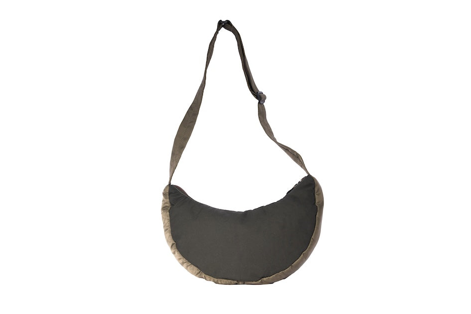 Olive Boat [Medium] crescent crossbody bag with adjustable strap, handmade from repurposed MA-1 flight jacket material and deadstock Halley Stevensons dry waxed cotton material. Back