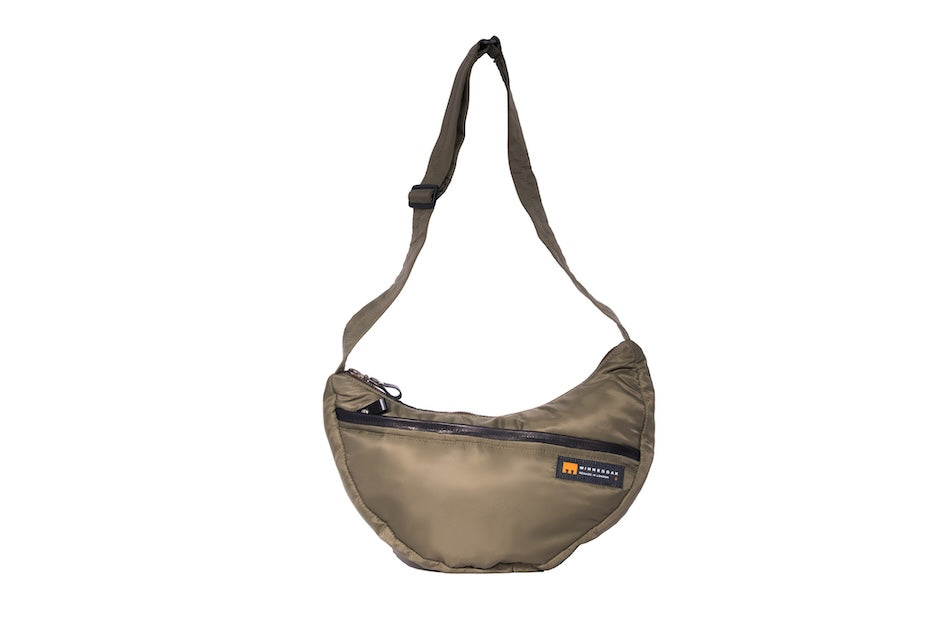 Olive Boat [Medium] crescent crossbody bag with adjustable strap and front zip pocket, handmade from repurposed MA-1 flight jacket material. Front