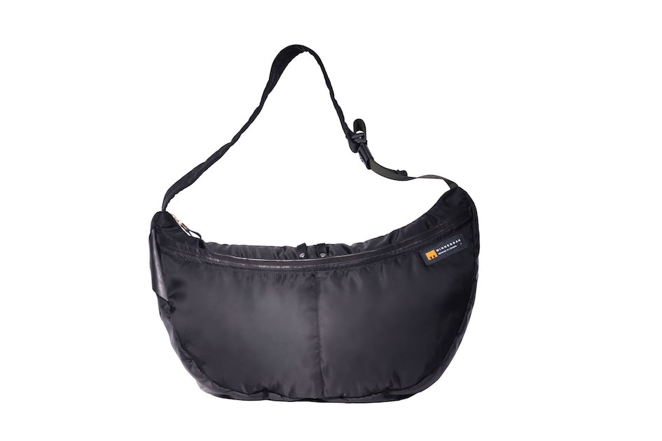 Black Boat Large, front, sustainable crossbody bag handmade from repurposed MA-1 flight jacket material with adjustable strap and two front zip pockets.