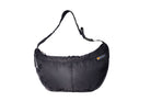 Black Boat Large, front, sustainable crossbody bag handmade from repurposed MA-1 flight jacket material with adjustable strap and two front zip pockets.