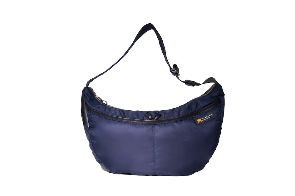 Navy Boat Large, front, sustainable crossbody bag handmade from repurposed MA-1 flight jacket material with adjustable strap and two front zip pockets.