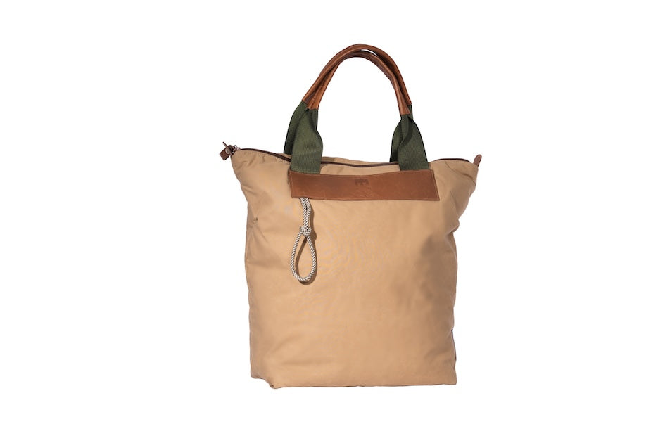 Beige Gripper tote bag made from deadstock Halley Stevensons dry waxed cotton with polypropylene handles and vintage Italian leather grips and cord detail. Handmade in London.