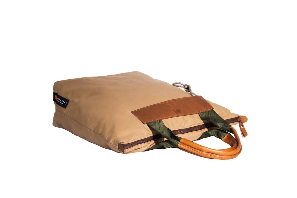 Beige Gripper tote bag made from deadstock Halley Stevensons dry waxed cotton with polypropylene handles and vintage Italian leather grips, handmade in London.