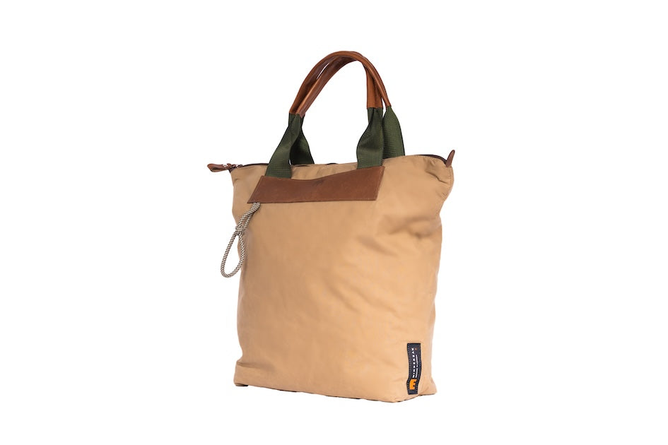 Beige Gripper tote bag made from deadstock Halley Stevensons dry waxed cotton with polypropylene handles and vintage Italian leather grips, handmade in London.