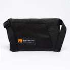 Small cross body bag in black with MInnessak logo on white background