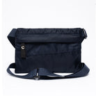 Small cross body bag in navy on a white background