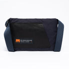 Small cross body bag in navy with straps and MInnessak logo on a white background